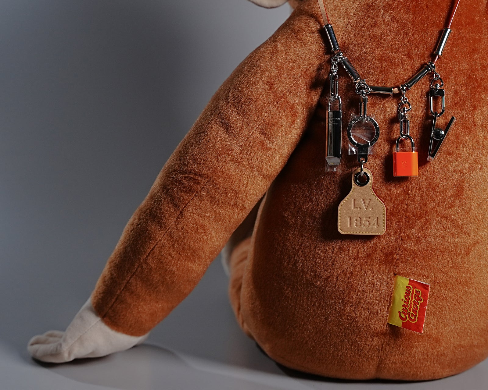 Giant Curious George Plush with Louis Vuitton Collier Survival Necklace