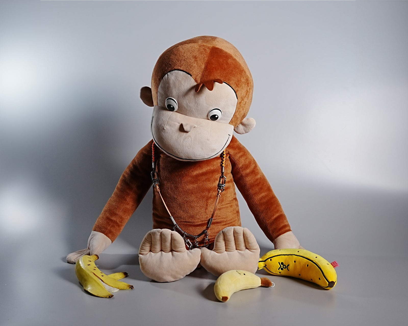 Giant Curious George Plush with Louis Vuitton Collier Survival Necklace
