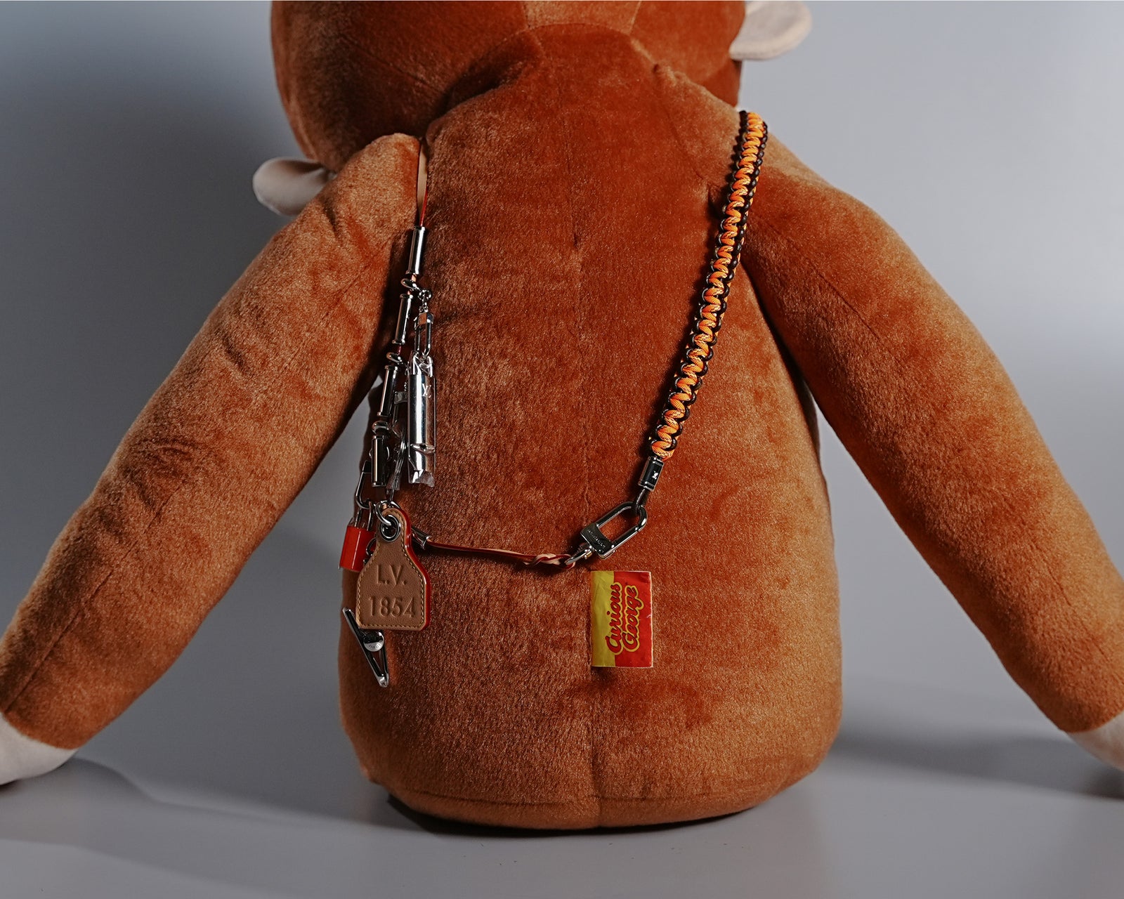 Giant Curious George Plush with Louis Vuitton Collier Survival Necklace